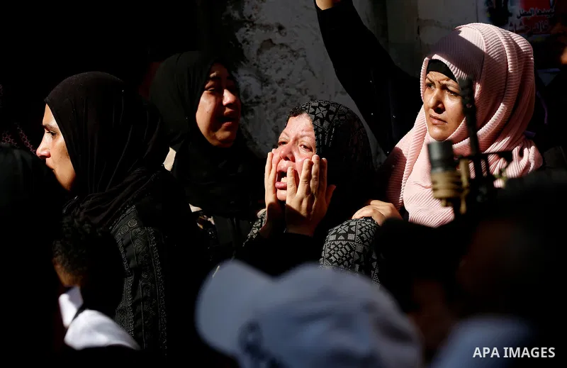 Palestinians attend the funeral of 15-year-old Palestinian Imad Khaled Saleh Hashash at the Balata refugee camp, in the north of the West Bank on August 24, 2021. The Palestinian teenager was killed by Israeli fire early...
