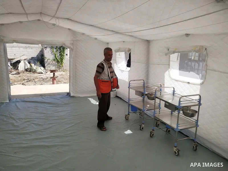 Palestinian Red Crescent teams set up temporary medical centers near the border fence in Khan Yunis, in the southern Gaza Strip, ahead of a protest anti-Israel on August 25, 2021. Photo by Ashraf Amra