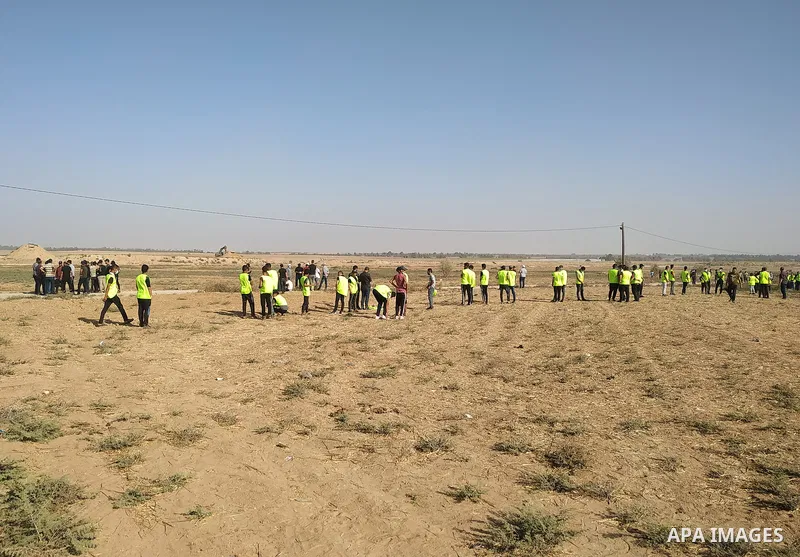 Palestinians gather ahead of a protest anti-Israel near the border fence in Khan Yunis, in the southern Gaza Strip on August 25, 2021. Palestinian groups in Gaza have pledged to continue protests along the border to pres...