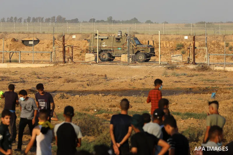 Palestinian demonstrators gather during a protest along the border fence, east of Khan Yunis in the southern Gaza Strip, on August 25, 2021. Palestinian groups in Gaza have pledged to continue protests along the border t...