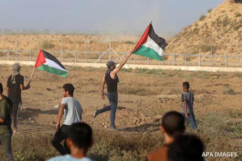 Palestinian demonstrators gather during a protest along the border fence, east of Khan Yunis in the southern Gaza Strip, on August 25, 2021. Palestinian groups in Gaza have pledged to continue protests along the border t...