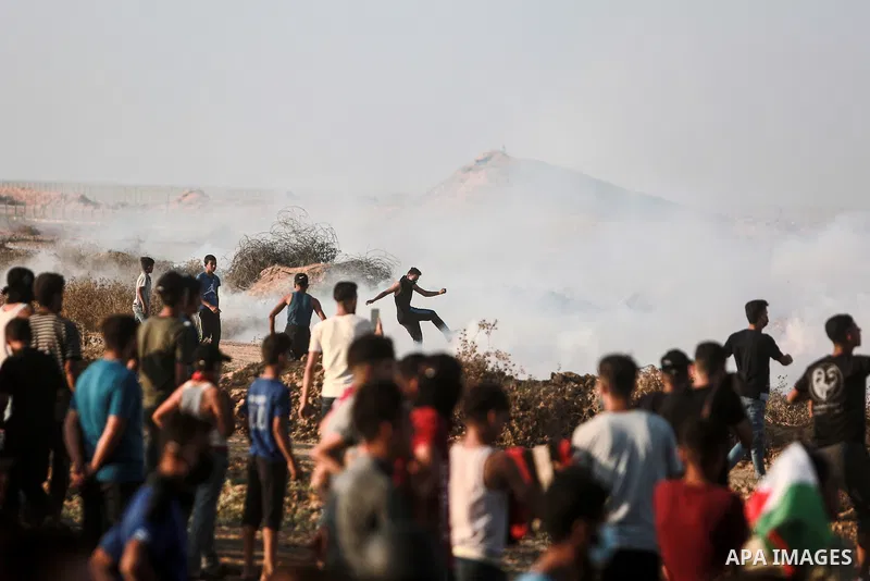 Palestinian demonstrators gather during a protest along the border fence, east of Khan Yunis in the southern Gaza Strip, on August 25, 2021. Palestinian groups in Gaza have pledged to continue protests along the border t...