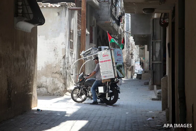 Palestinian Daoud Al-Bouji, 46, from Gaza sells pastries using a mobile bakery called "Six Girls food", at the streets of Al-Shati refugee camp, west of Gaza City, to force unemployment, on August 26, 2021. According to...