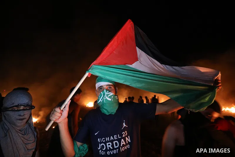 Members of Palestinian protesters calling themselves the "night confusion units", burns tires as they gather near the Gaza-Israel border east of Gaza city, August 28, 2019. Hundreds of Palestinian protesters, have been o...