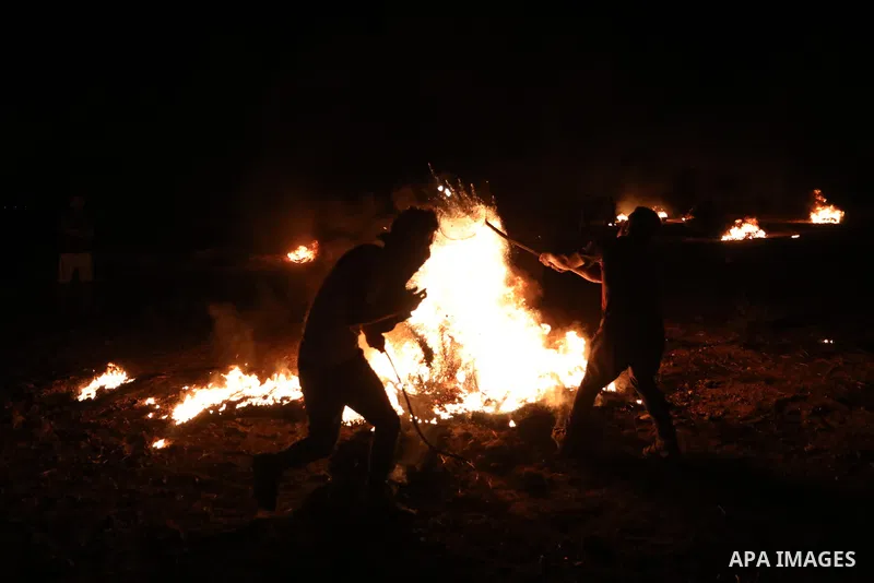 Members of Palestinian protesters calling themselves the "night confusion units", burns tires as they gather near the Gaza-Israel border east of Gaza city, August 28, 2019. Hundreds of Palestinian protesters, have been o...