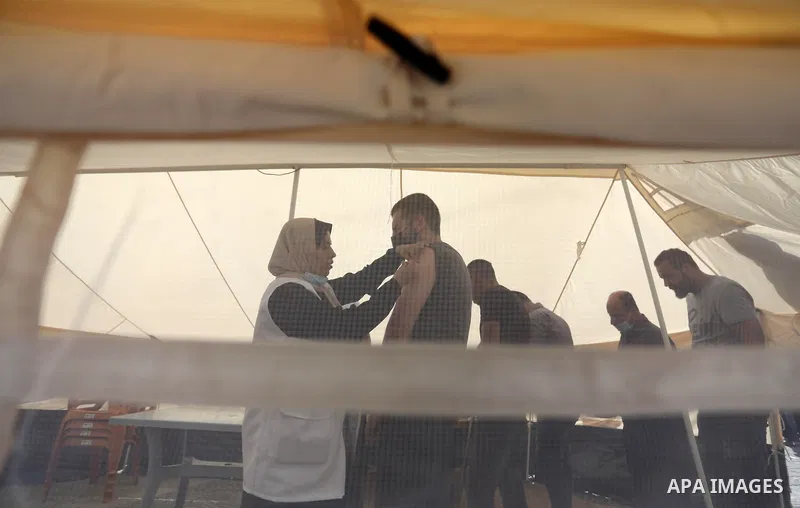 Palestinians get inoculated with a dose of the Covishield vaccine against the Covid-19 coronavirus, at a temporary vaccination centre set up, in Gaza city on August 29, 2021. Palestine Ministry of Health said that 196254...