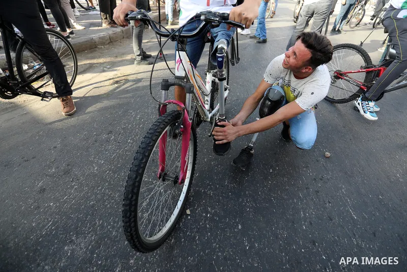 Disabled Palestinians participate in a bicycle race, at Gaza sea port on August 29, 2021. Almost 50,000 Palestinians are classified as "disabled" among the 2-million population of the blockaded Gaza Strip. The number is...