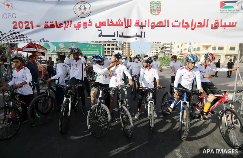 Disabled Palestinians participate in a bicycle race, at Gaza sea port on August 29, 2021. Almost 50,000 Palestinians are classified as "disabled" among the 2-million population of the blockaded Gaza Strip. The number is...