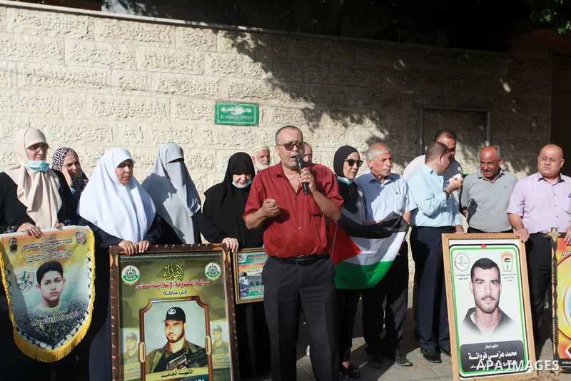 Palestinians take part in a rally demanding to return the bodies of Palestinians who killed by Israeli army and detained them, in front of Red Cross office in Gaza city, on August 29, 2021. Palestinians mark the National...