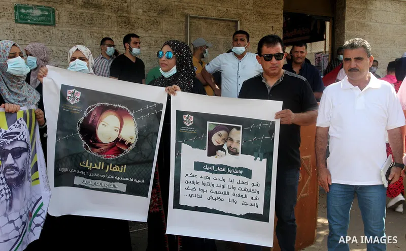 Palestinians take part in a protest to show solidarity with prisoners in Israeli Jails, in front of the headquarters of Red cross, in Gaza city, on August 30, 2021. There are around 4,850 Palestinian detainees in Israeli...