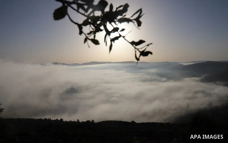 Morning fog covers the landscape in the town of al-Lubban al-Sharqiya near the West Bank city of Nablus, 30 August 2021. Photo by Wajed Nobani