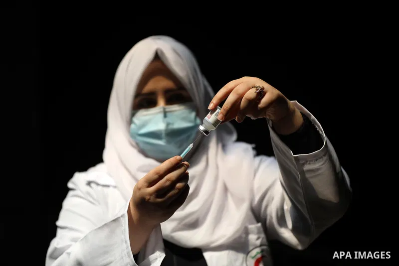 Palestinian medicals and activists participate during the "Awareness Bus" initiative to educate people about the Corona vaccine in poor areas, in Beit Lahia in the northern of Gaza Strip on September 2, 2021. Photo by As...