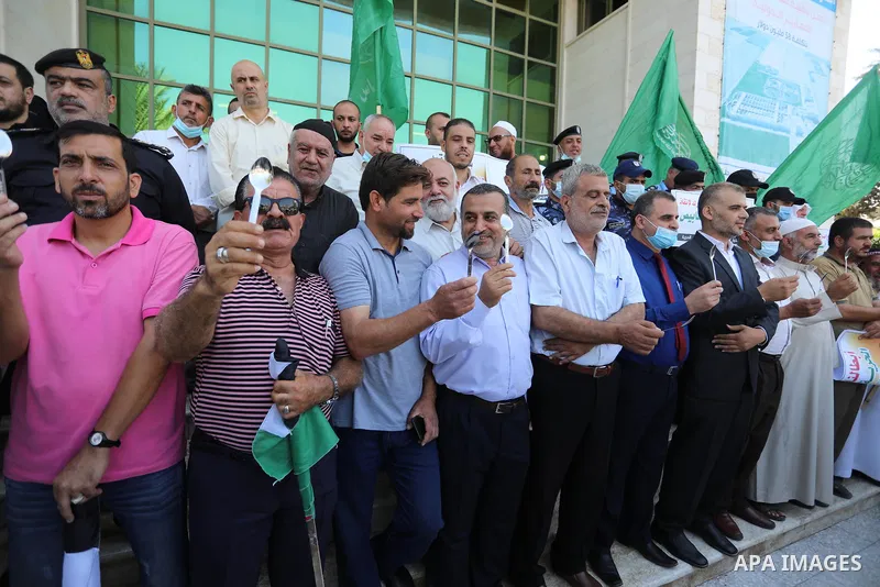 Palestinians take part in a protest to show solidarity with prisoners held in Israeli Jails, in Khan Younis in the southern of Gaza strip, on September 8, 2021. In a step seen as vengeance following the escape yesterday...