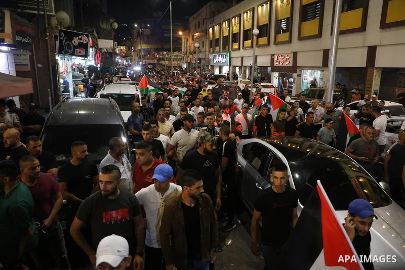 Demonstrators take part in a protest in support of Palestinian prisoners held in Israeli jails, in the West Bank city of Jenin, September 8, 2021. - Six Palestinians broke out of the Israeli Gilboa prison on September 6...