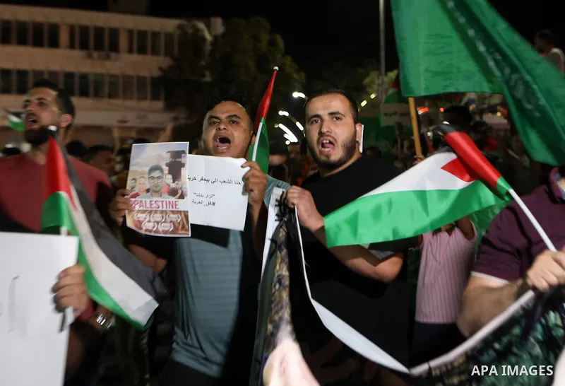 Demonstrators take part in a rally in support of Palestinian prisoners held in Israeli jails, in the West Bank city of Hebron, on September 8, 2021. - Six Palestinians broke out of the Israeli Gilboa prison on September...