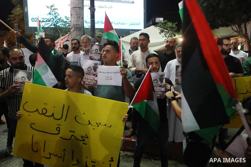 Demonstrators take part in a rally in support of Palestinian prisoners held in Israeli jails, in the West Bank city of Hebron, on September 8, 2021. - Six Palestinians broke out of the Israeli Gilboa prison on September...