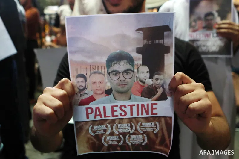 Demonstrators take part in a rally in support of Palestinian prisoners held in Israeli jails, in the West Bank city of Hebron, on September 8, 2021. - Six Palestinians broke out of the Israeli Gilboa prison on September...