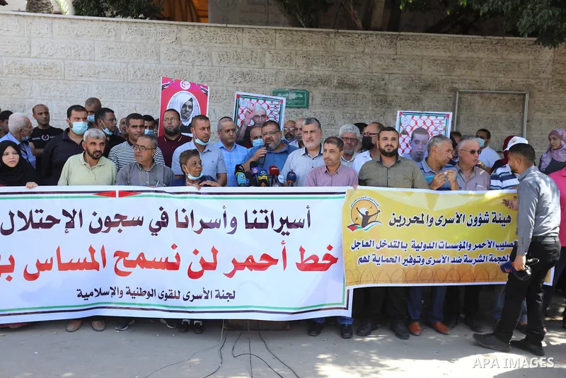 Palestinians take part in a protest in support of prisoners held in Israeli jails, in front of Red cross in Gaza city, September 9, 2021. In a step seen as vengeance following the escape yesterday of six Palestinian resi...