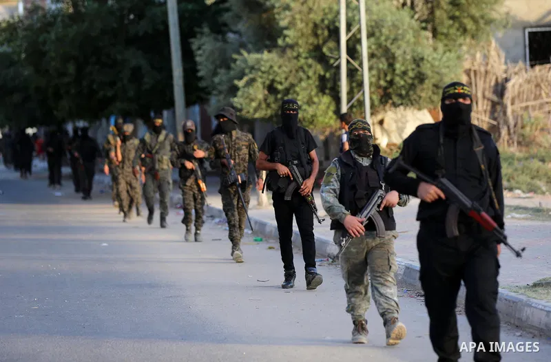 Palestinian militants from the Al-Quds Brigades, the armed wing of the Islamic Jihad movement, take part in a military parade, in support of prisoners held in Israeli jails in Deir al-Balah in the center of Gaza Strip, o...