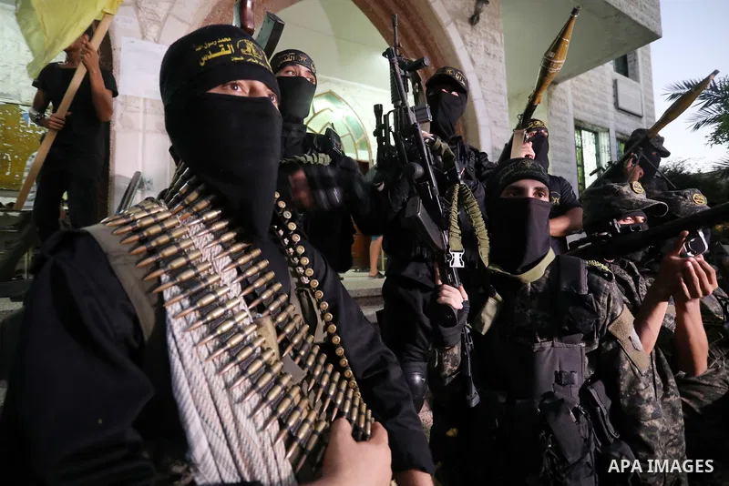Palestinian militants from the Al-Quds Brigades, the armed wing of the Islamic Jihad movement, take part in a military parade, in support of prisoners held in Israeli jails in Deir al-Balah in the center of Gaza Strip, o...