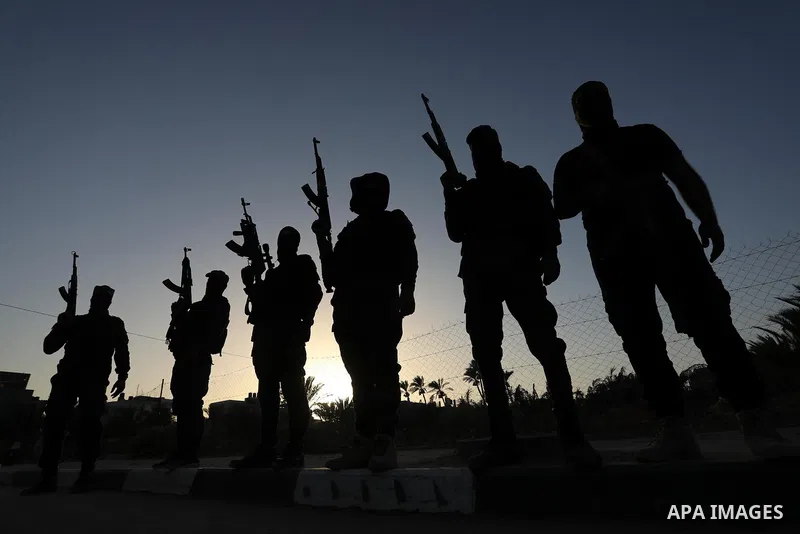 Palestinian militants from the Al-Quds Brigades, the armed wing of the Islamic Jihad movement, take part in a military parade, in support of prisoners held in Israeli jails in Deir al-Balah in the center of Gaza Strip, o...