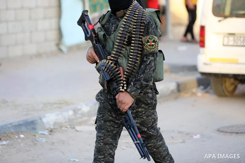 Palestinian militants from the Al-Quds Brigades, the armed wing of the Islamic Jihad movement, take part in a military parade, in support of prisoners held in Israeli jails in Deir al-Balah in the center of Gaza Strip, o...