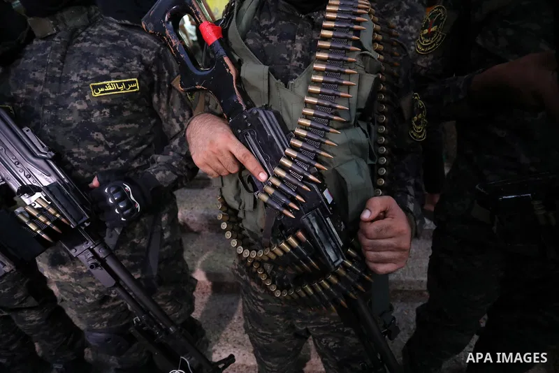 Palestinian militants from the Al-Quds Brigades, the armed wing of the Islamic Jihad movement, take part in a military parade, in support of prisoners held in Israeli jails in Deir al-Balah in the center of Gaza Strip, o...
