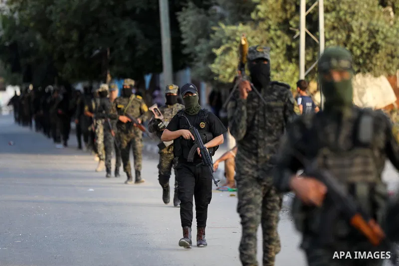 Palestinian militants from the Al-Quds Brigades, the armed wing of the Islamic Jihad movement, take part in a military parade, in support of prisoners held in Israeli jails in Deir al-Balah in the center of Gaza Strip, o...