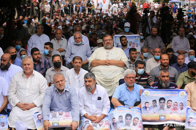 Palestinians attend Friday prayer in solidarity with prisoners in Israeli jails, in front of Red cross office, in Gaza city, on September 10, 2021. Israeli troops have arrested at least six family members in the West Ban...