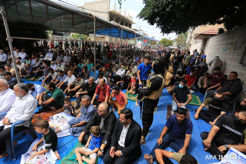 Palestinians attend Friday prayer in solidarity with prisoners in Israeli jails, in front of Red cross office, in Gaza city, on September 10, 2021. Israeli troops have arrested at least six family members in the West Ban...