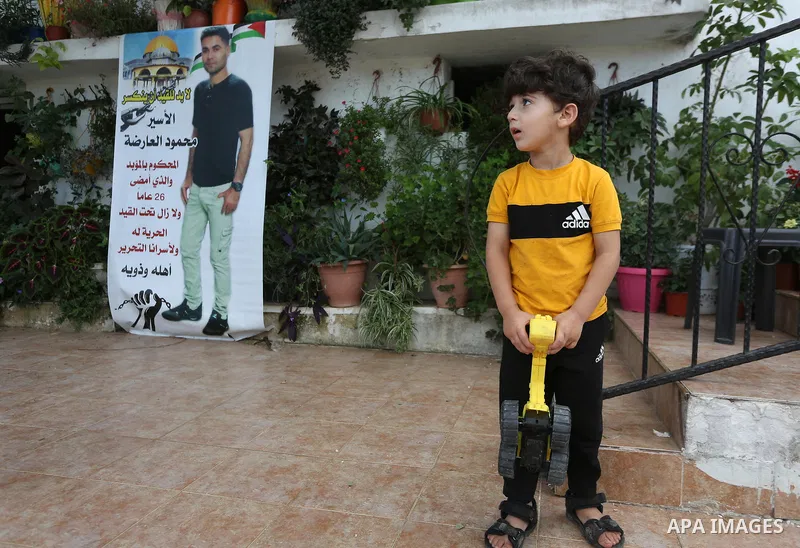 The family of the Palestinian Mahmoud Arda, who was arrested following his escape from Gilboa prison, sit in his family house in the West Bank city of Jenin on 11 Sebtember 2021. Two more of the six Gilboa prison freedom...
