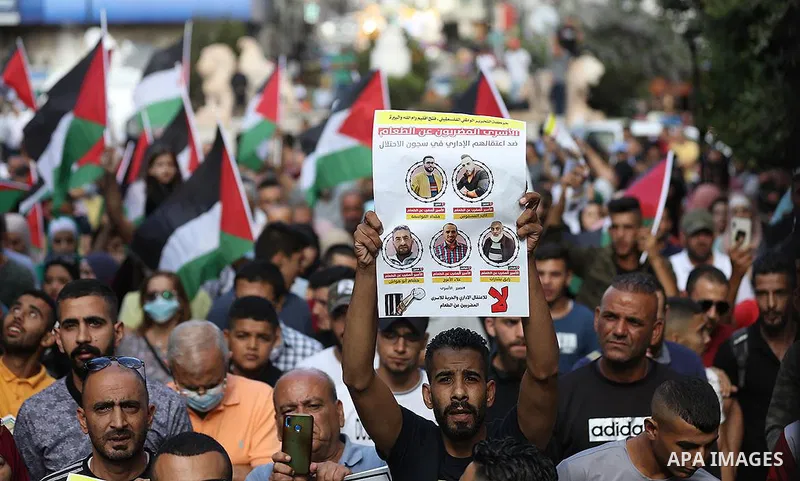 Palestinians take part in a protest in support of prisoners who were arrested following their escape from Gilboa prison, in the West Bank city of Ramallah, on 11 Sebtember 2021. Two more of the six Gilboa prison freedom...