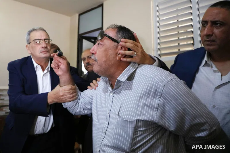 Members of the revolutionary council of the Fatah movement visit the family of the Palestinian Zakaria Zubeidi, who was arrested following his escape from Gilboa prison in the West Bank city of Jenin on September 13, 202...
