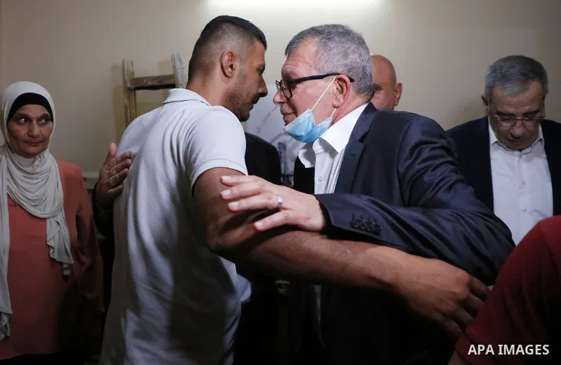 Members of the revolutionary council of the Fatah movement visit the family of the Palestinian Zakaria Zubeidi, who was arrested following his escape from Gilboa prison in the West Bank city of Jenin on September 13, 202...