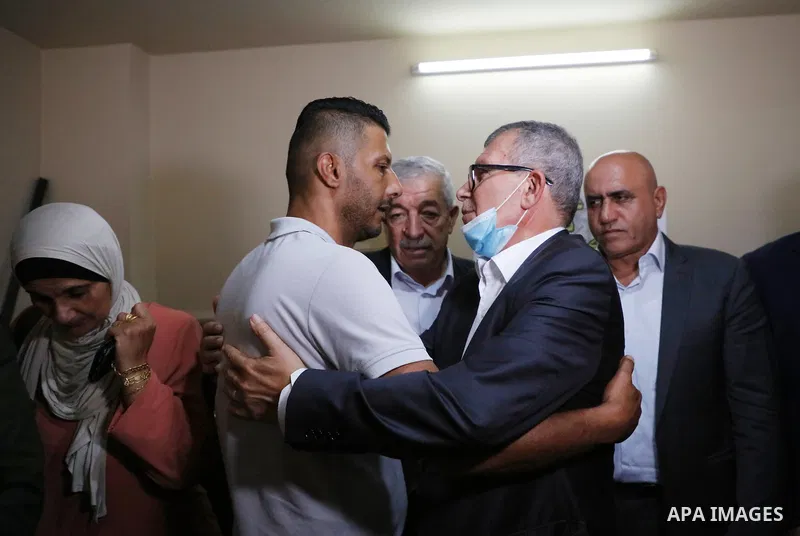 Members of the revolutionary council of the Fatah movement visit the family of the Palestinian Zakaria Zubeidi, who was arrested following his escape from Gilboa prison in the West Bank city of Jenin on September 13, 202...