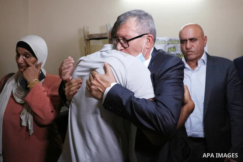 Members of the revolutionary council of the Fatah movement visit the family of the Palestinian Zakaria Zubeidi, who was arrested following his escape from Gilboa prison in the West Bank city of Jenin on September 13, 202...
