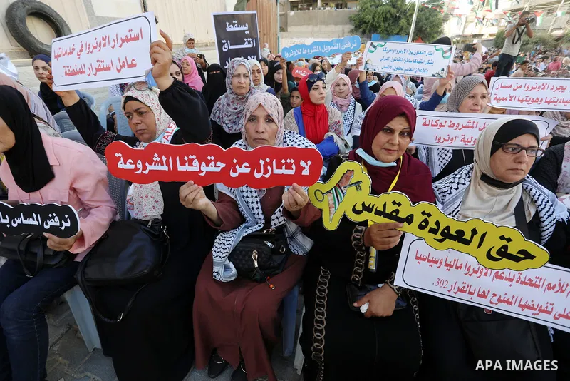 Palestinians take part in a protest against the United States and UNRWA signing a Framework for Cooperation, in Gaza city on September 14, 2021. The Framework for Cooperation states, “The US will not make any contributio...