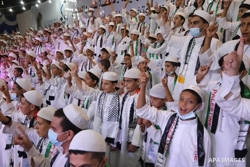 Palestinian children attend a ceremony of the honor the memorizers of the Holy Koran, in Khan Younis in the southern of Gaza Strip, on September 17, 2021. Photo by Ashraf Amra