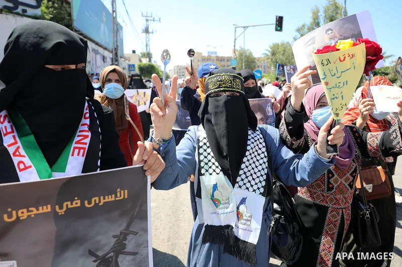 Palestinians take part in solidarity with prisoners in Israeli jails in Gaza city on September 19, 2021. Israeli forces last night captured Ayham Kamamji and Munadel Nufei’at, the last Palestinian freedom fighters to rem...