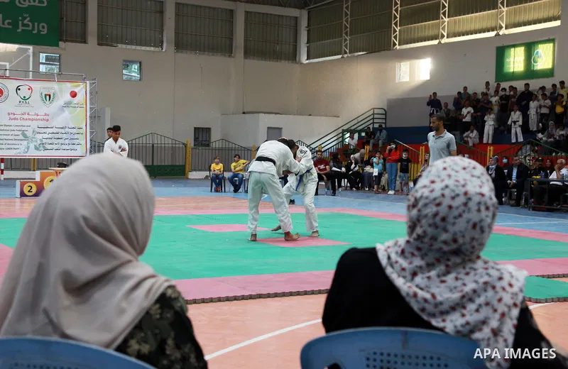 Palestinian players fight during a local Judo Championship, in Gaza city on September 19, 2021. Judo is generally categorized as a modern Japanese martial art, which has since evolved into an Olympic and Paralympic event...