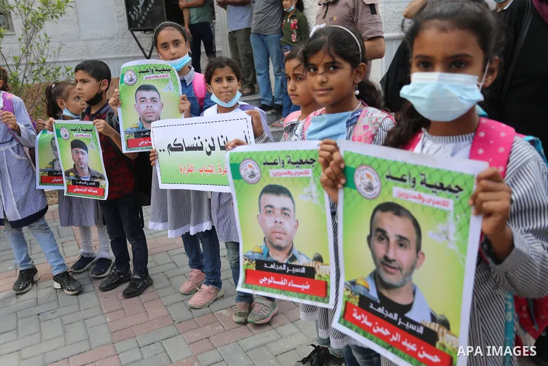 Palestinians take part in a protest to show solidarity with prisoners in Israeli Jails, in Khan Younis in the southern of Gaza strip, on September 23, 2021. The Prisoners’ Affairs Commission announced in a press statemen...