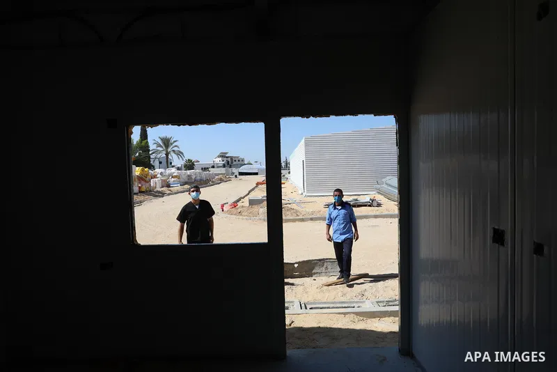 Palestinians work on the building the field hospital to house coronavirus disease (COVID-19), patients at European Gaza Hospital in Rafah in the southern of Gaza Strip, on September 25, 2021. COVID-19 claimed the life of...