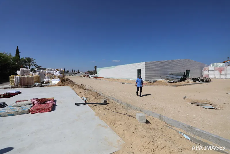 Palestinians work on the building the field hospital to house coronavirus disease (COVID-19), patients at European Gaza Hospital in Rafah in the southern of Gaza Strip, on September 25, 2021. COVID-19 claimed the life of...