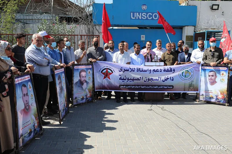 Palestinians take part in a protest to show solidarity with prisoners in Israeli Jails, in front of the UNESCO headquarters in Gaza city, on Sebtember 26, 2021. Palestinian administrative detainees believe hunger strike...