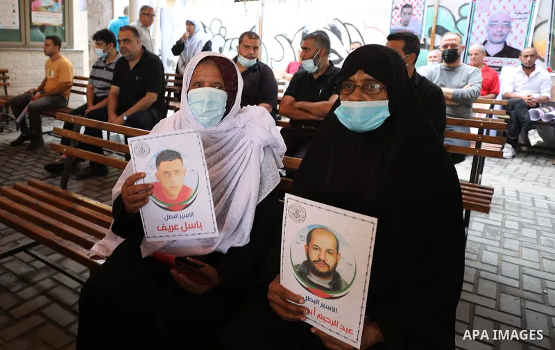 Palestinians take part in a protest to show solidarity with prisoners in Israeli Jails, in front of Red cross office in Gaza city, on Sebtember 27, 2021. Palestinian administrative detainees believe hunger strike is the...