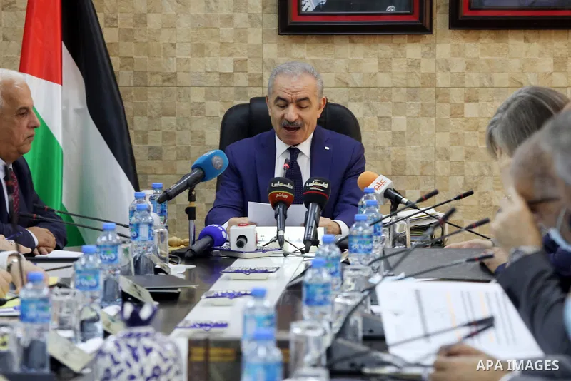 Palestinian Prime Minister Mohammed Ishtayeh heads the weekly cabinet meeting in the West Bank town of Hebron on September 27, 2021. Photo by Mamoun Wazwaz