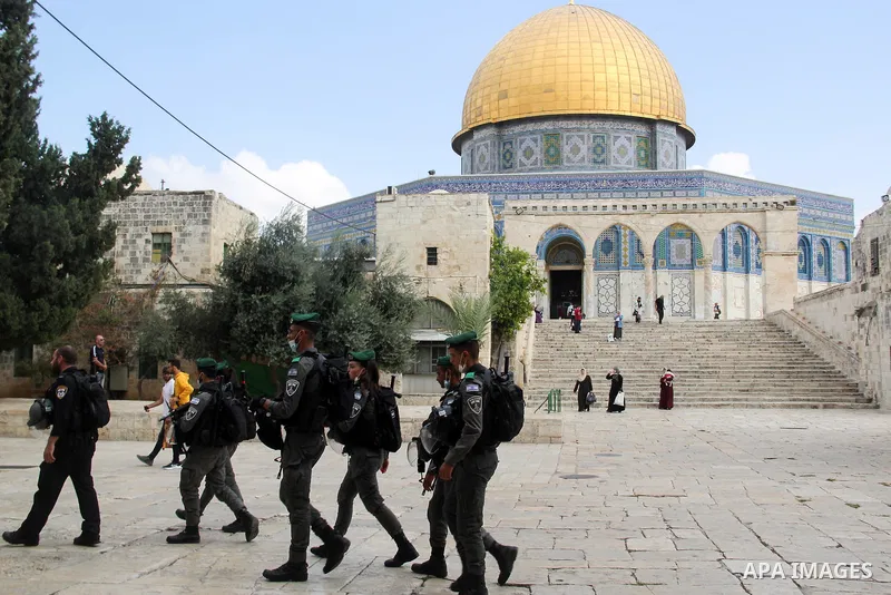 Israeli police officers stand guard as Jews visit the the Al Aqsa Mosque compound, during the celebration of the seventh day of Sukkot, the Feast of the Tabernacles, in Jerusalem on September 27, 2021. Photo by Mahfouz A...