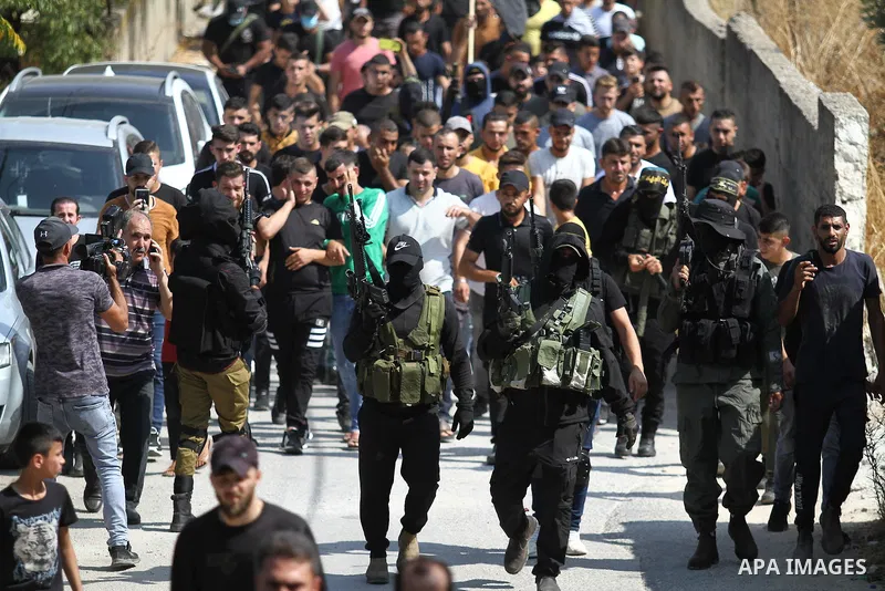 Palestinians carry the body of member of Islamic Jihad Alaa Zayoud, 22, who was killed in clashes with Israeli forces earlier, during his funeral at his village of Silat al-Harithiyah, east of Jenin in the occupied West...