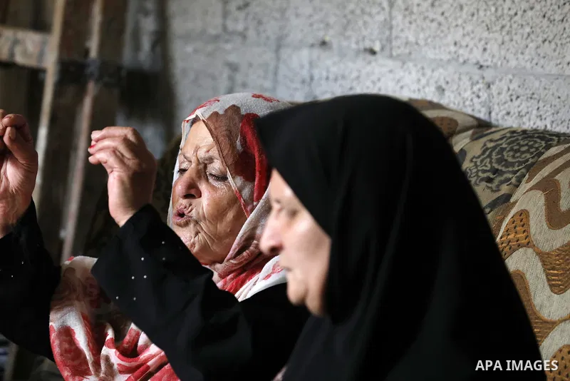 Mourners attend the funeral of Mohammad Abu Ammar, 40, a Palestinian who was killed by Israeli fire at the Israel-Gaza border fence, according to health ministry, in Bureij in the central Gaza Strip on September 30, 2021...