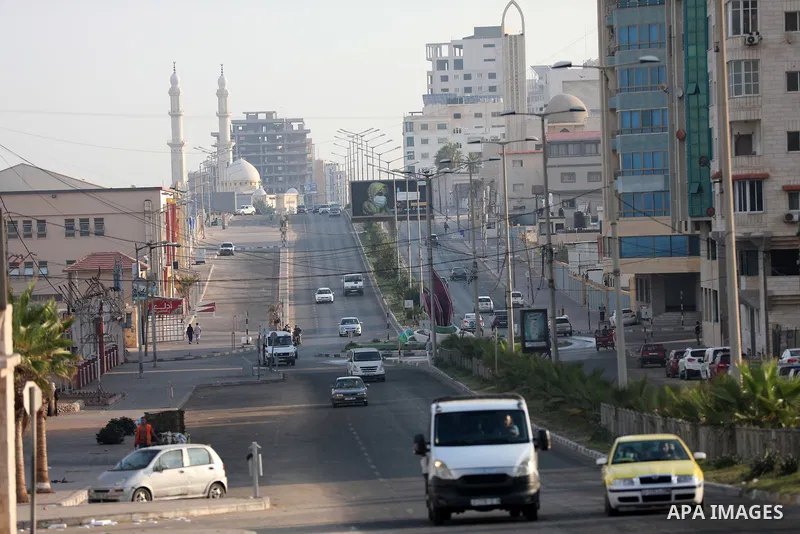 Paestinians walk at a deserted street, in Gaza city on October 04, 2021. Twelve people have died of coronavirus in Palestine in the last 24 hours as 1559 new cases were confirmed, today said Minister of Health Mai Alkail...